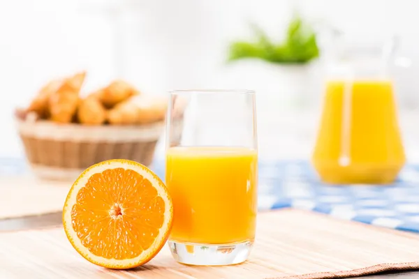 Orange and a glass of orange juice