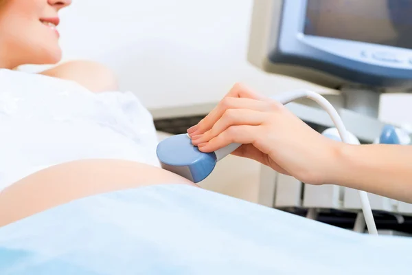 Hands and abdominal ultrasound scanner
