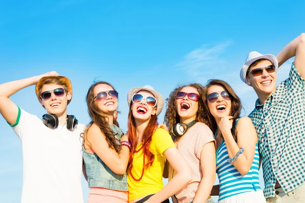 Group of young people wearing sunglasses and hat