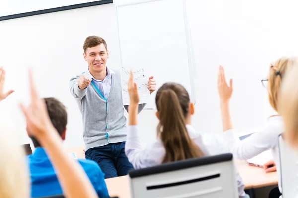 Teacher talking with students