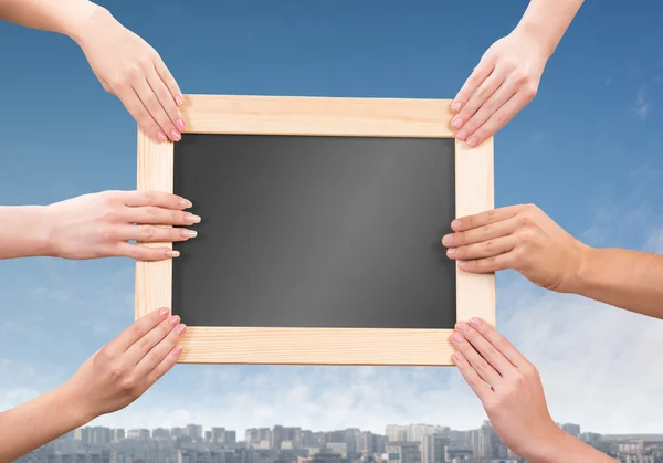 Hands holding frame