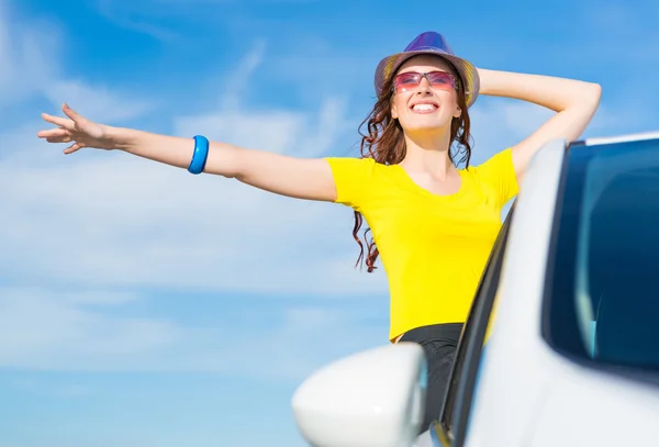 Young woman on car