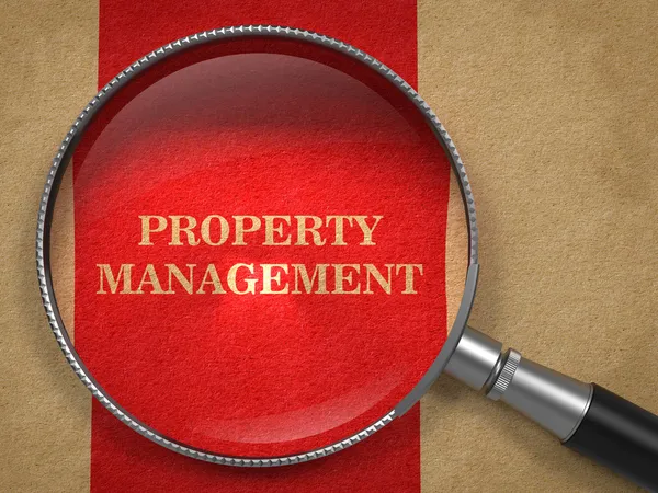 Property Management. Magnifying Glass on Old Paper.