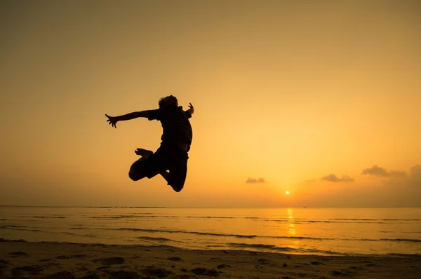 Silhouette of happy man jumping