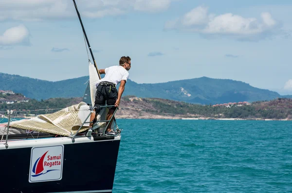 Man on the stern of the yacht