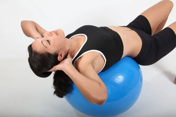 Fit woman workout on exercise ball