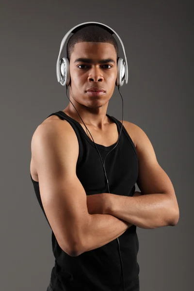Headphones on handsome african american music DJ