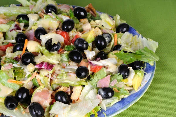 Fresh salad with black olives and avocado
