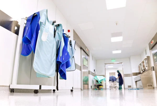 Hospital corridor with doctor protective uniforms