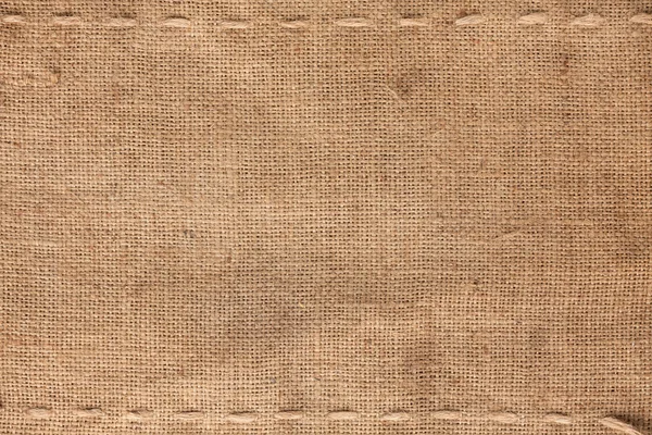 The two horizontal stitching on the burlap