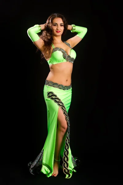 Brunette in a green suit oriental dance