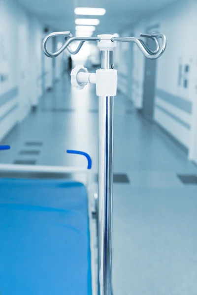 Long corridor in hospital with trolly and rack