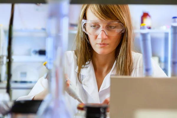 Young woman scientist in laboratory