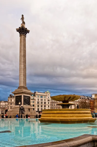 Trafalgar Square in London with dramatic sky