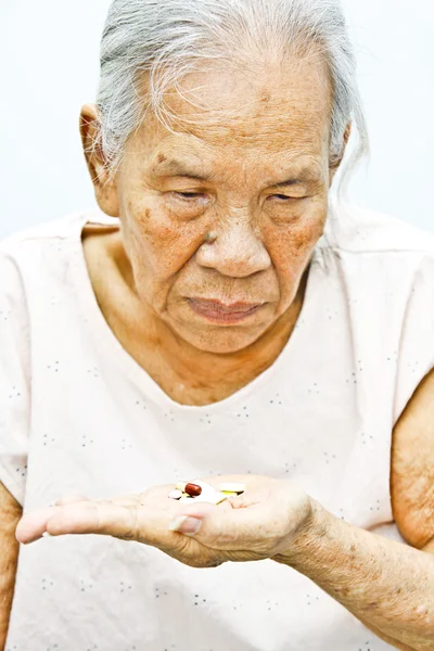 Old woman Taking pills