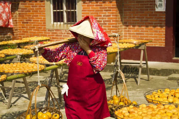 Worker in persimmon processing