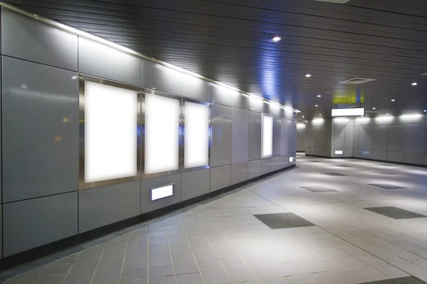 Blank billboard in metro station