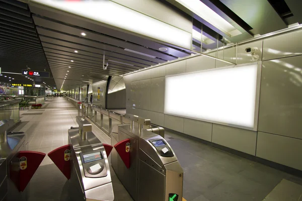 Blank billboard in metro station