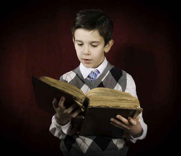 Child with red vintage book
