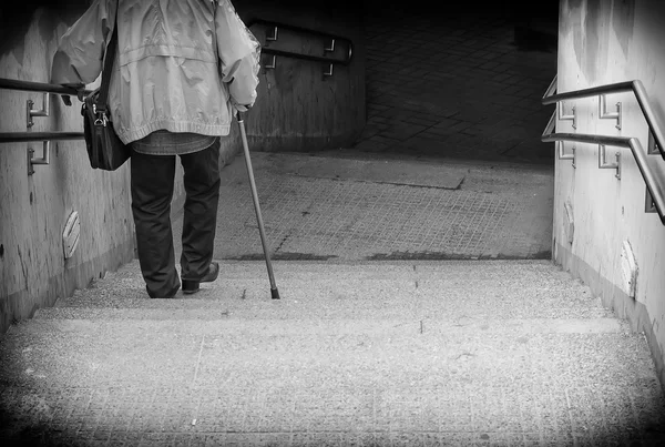 Rare view of senior coming down stairs. Black and white