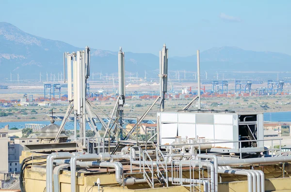 Industrial refrigeration equipment on the roof.