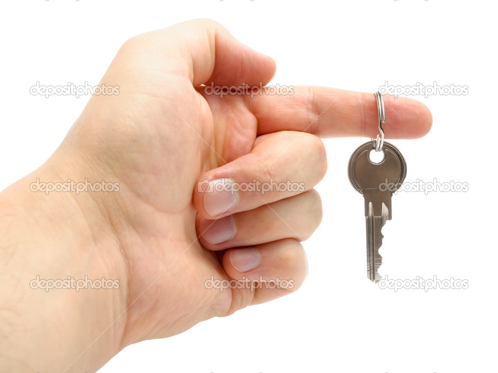 Hand holding a key isolated on white background — Stock Photo