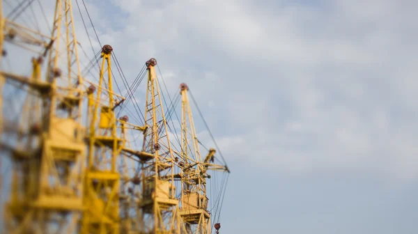 Tilt-shift photo of building cranes