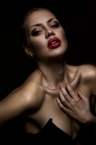 Portrait of a beautiful fashion model with red lips