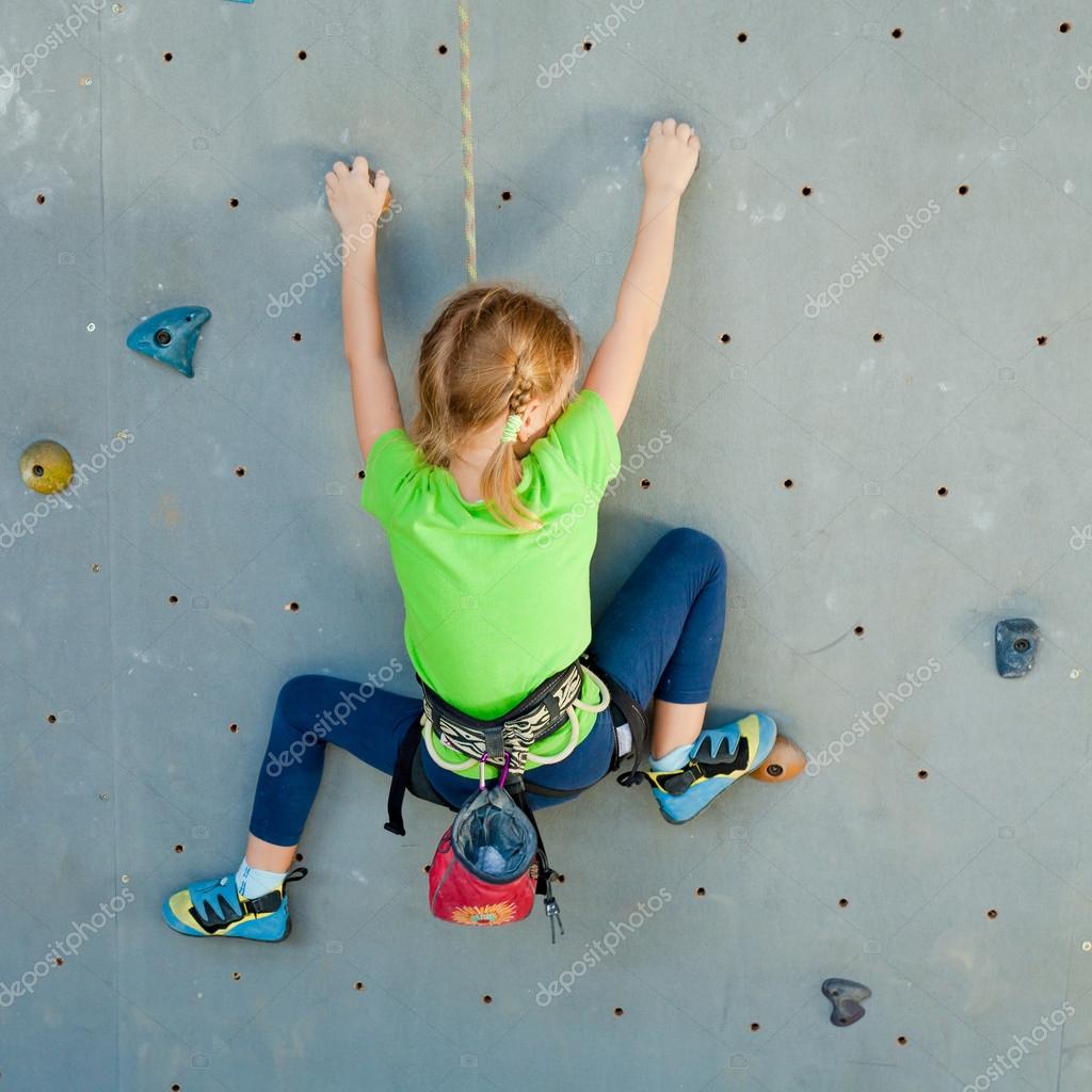 Little Girl Climbing Rock Wall — Stock Photo © altanaka 35530843