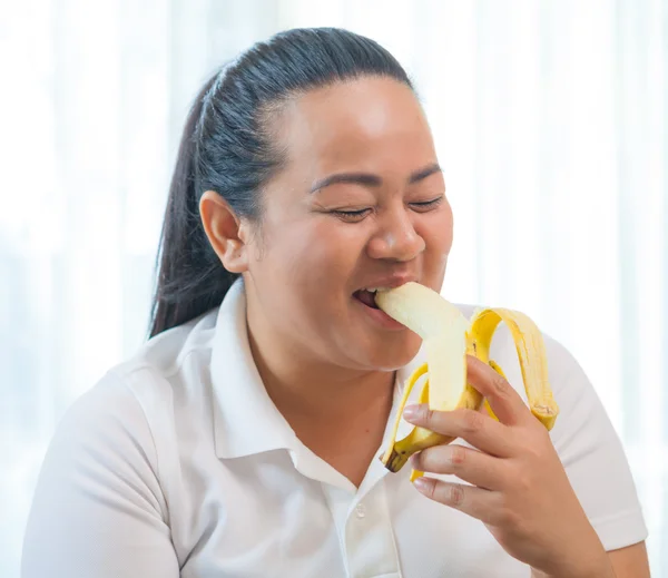 Fat woman with banana