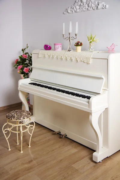 White room with the piano