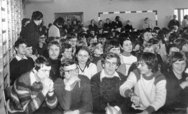 Students sitting in big school hall