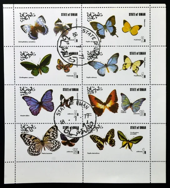 A collection stamps printed in Oman shows a series of eight pictures of butterflies