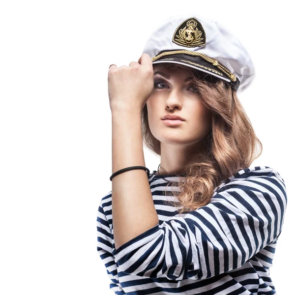 Young Beautiful Adorable Woman in sea peak-cap and stripped vest. Girl - Captain\'s in sexy sailor T-shirt. Studio shot.