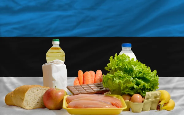 Basic food groceries in front of estonia national flag