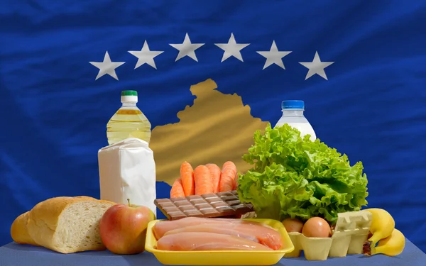 Basic food groceries in front of kosovo national flag
