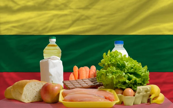 Basic food groceries in front of lithuania national flag