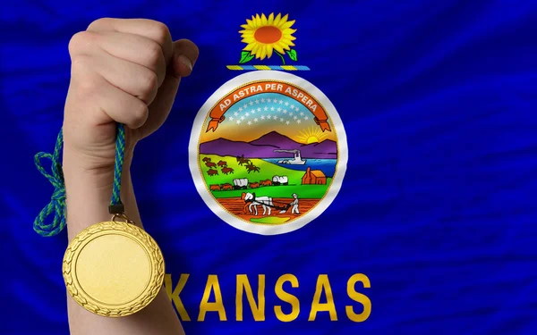 Gold medal for sport and flag of american state of kansas