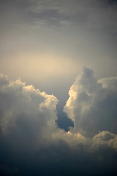 Strange heavy clouds with opening in the center