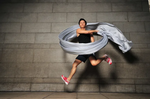 Asian chinese man doing a contemporary dance