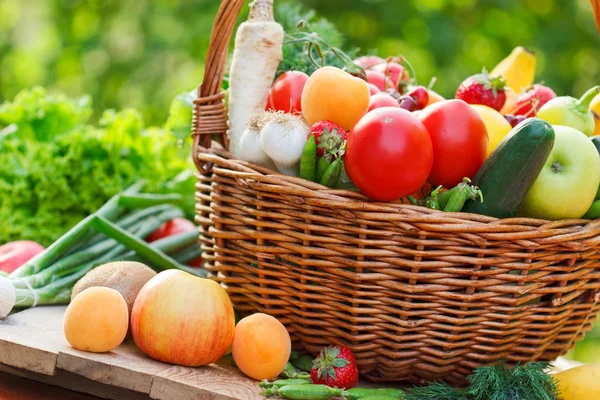 Basket full of organic fruit and vegetables
