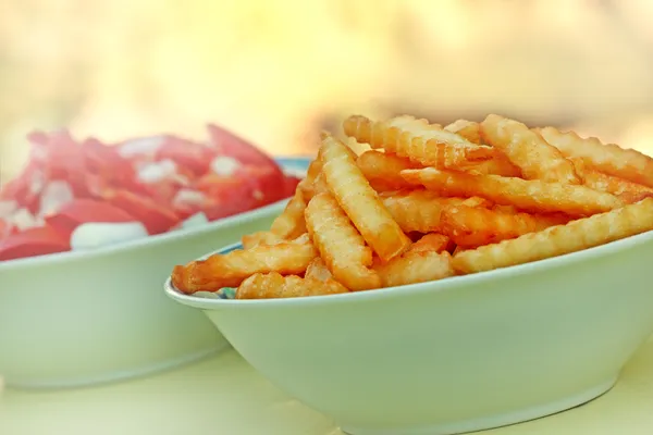 French fries and tomato salad