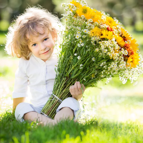 Child with bouquet flowers