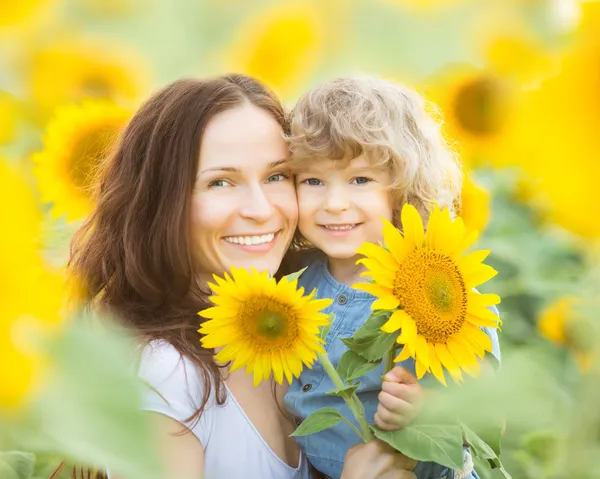 Womn and child in sunflower field