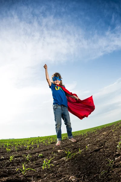 Superhero kid jumping