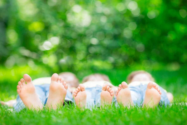 Family lying on grass