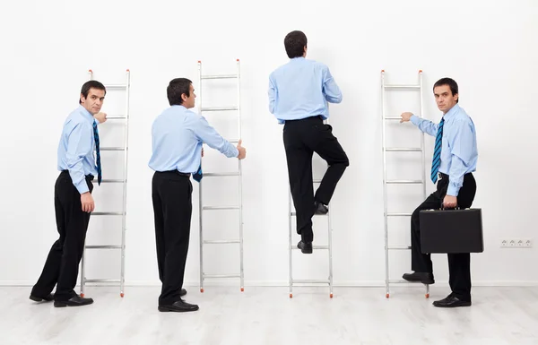 Employees climbing the corporate ladders