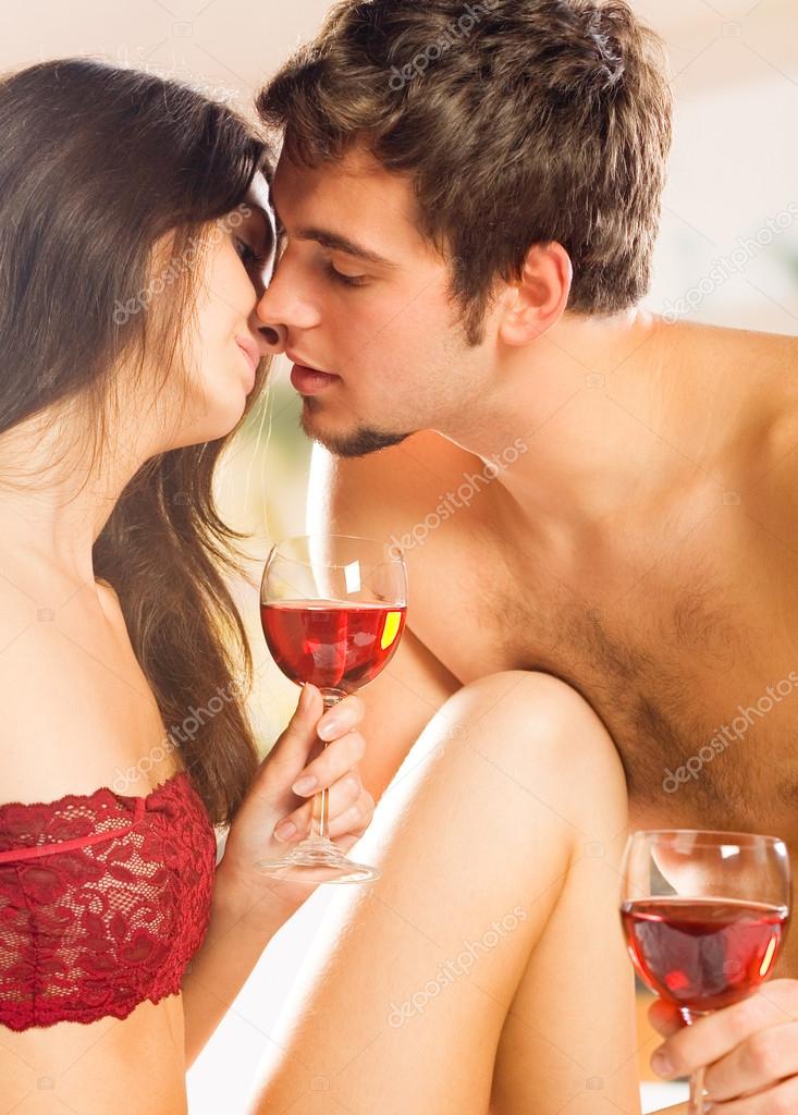 couple naked sipping wine Couple naked sipping wine