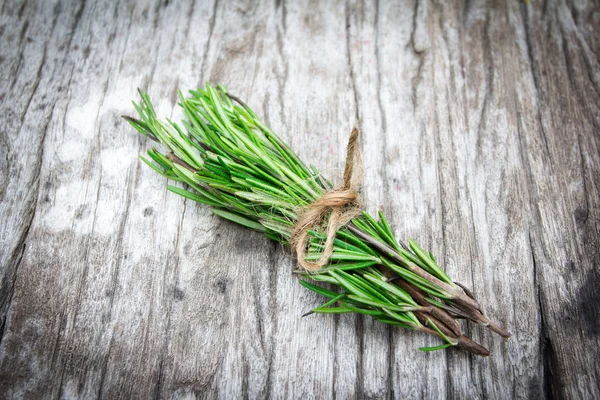 Rosemary bound on a wooden board