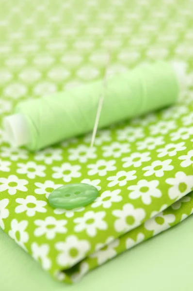 Sewing Items on Floral Cloth